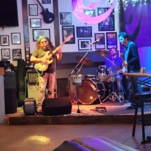 A group of people playing music on a stage