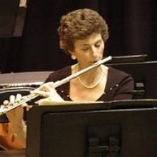 A woman playing a flute