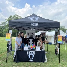 Outpost in the Burbs volunteers at an event