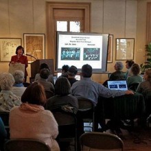 A group of people attending a lecture at the Trenton City Museum