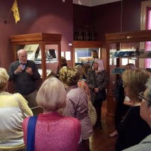 A group of people taking a tour of the Trenton City Museum