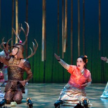 the cast of a musical performing onstage at McCarter Theatre