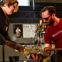 Two artists work with melted glass at WheatonArts