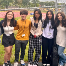 A group of seven students smiling at the camera