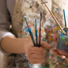 artist with paint brushes