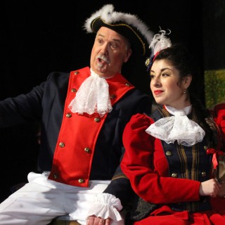 an old man and a young girl performing in a dance at the Light Opera of New Jersey