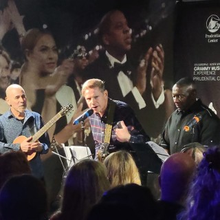 A group of people standing on stage at an event