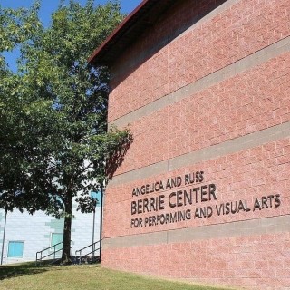 Red brick building with a sign that says Angelica And Russ Berrie Center For Performing And Visual Arts along the side
