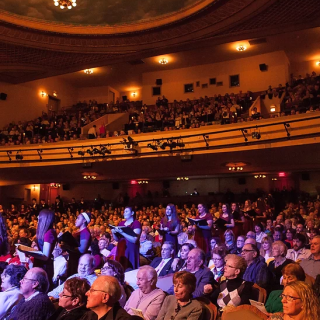 an audience listens to music at Count Basie Center for the Arts
