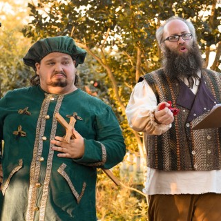 actors portraying medival characters performing outdoors