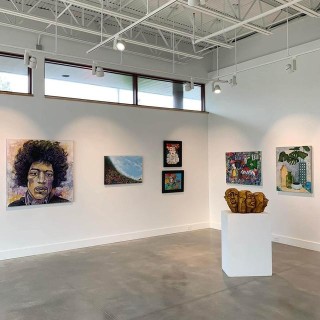 gallery with small windows full of paintings