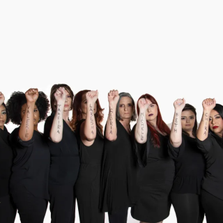 Group of women from Meta Theatre Company with names written on their arms