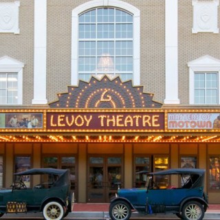 The lit-up marquee of the Levoy Theatre