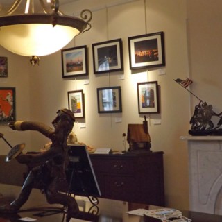 Several framed pictures on a wall