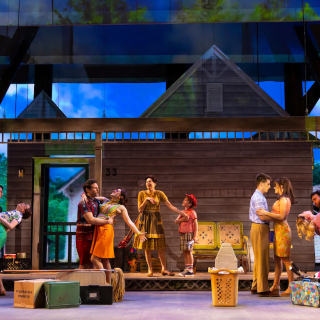 A group of actors performing on-stage at George Street Playhouse