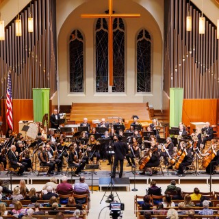 The Ridgewood Symphony Orchestra performing a concert in a church