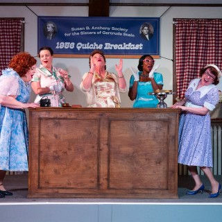 Five actresses in 50's inspired dresses.