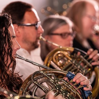 A group of musicians from the Philharmonic of Southern New Jersey playing french horns