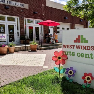 West Windsor Arts Center exterior: red brick building with a white sign that reads "West Windsor Arts Center".