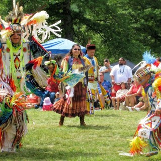 Redhawk Native American Arts Council artists performing at a pow wow