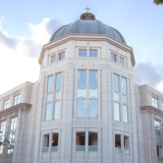 A white building with a domed roof.