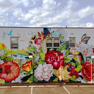 A colorful mural on the aide of a building