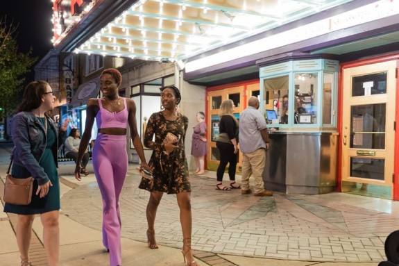 People walking around outside of the Ritz Theatre