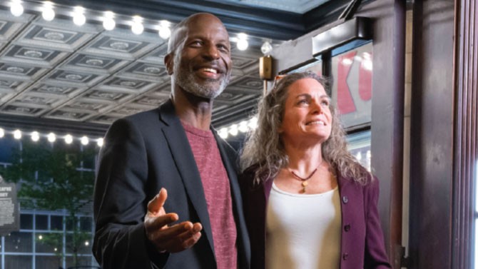 two people walking into a theatre