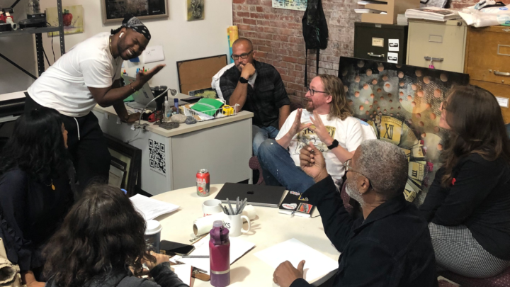 ArtWorks Trenton employees discussing the Art All Night event