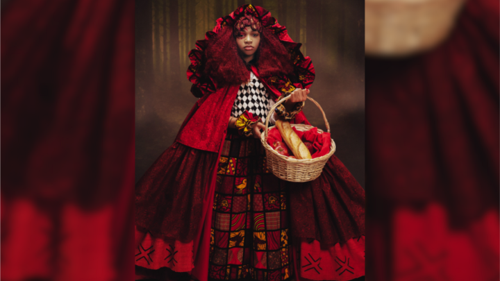 A woman in a red dress holding a basket with bread inside