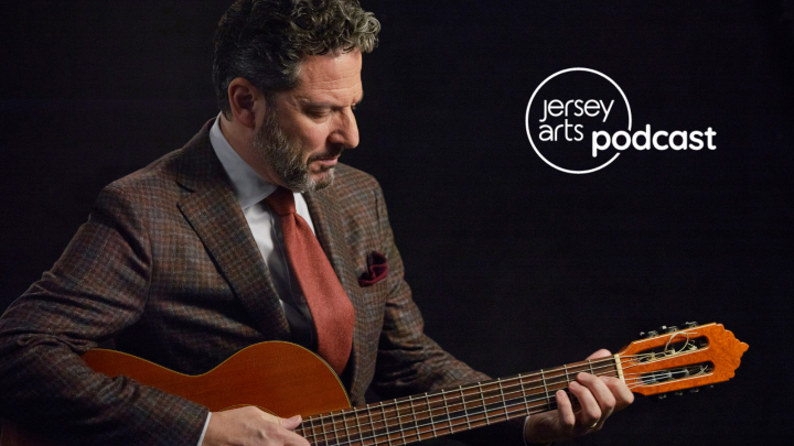 John Pizzarelli playing the guitar