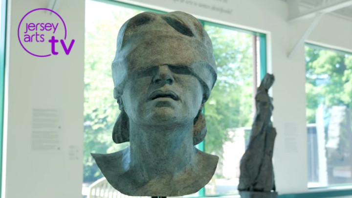 Sculpture of a person with a blindfold on