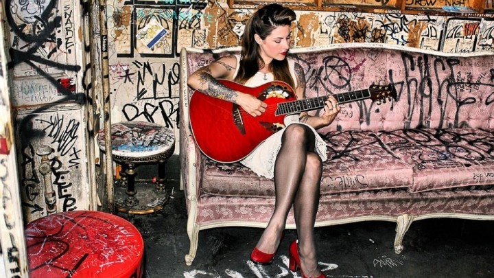 Ginger Coyle playing the guitar