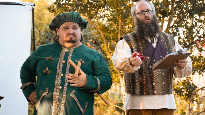 actors portraying medival characters performing outdoors