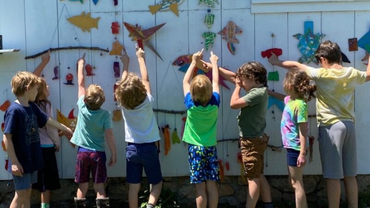 outdoor child's art class enjoy looking at their work