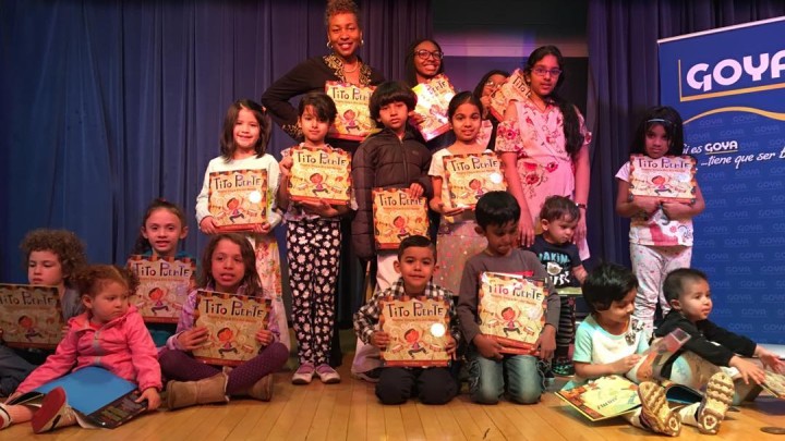 Small children onstage holding books at Winceyco