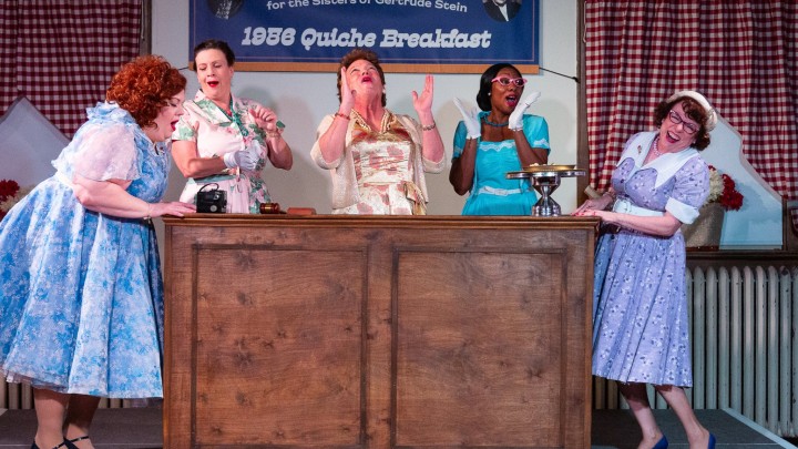 Five actresses in 50's inspired dresses.