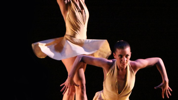Two dancers on stage in performance at Vineland Regional Dance Company.